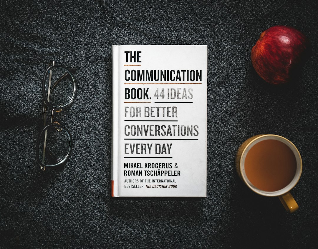 Illustrated cover for leadership communication strategies showing a leader briefing a hybrid team with clear messaging cues